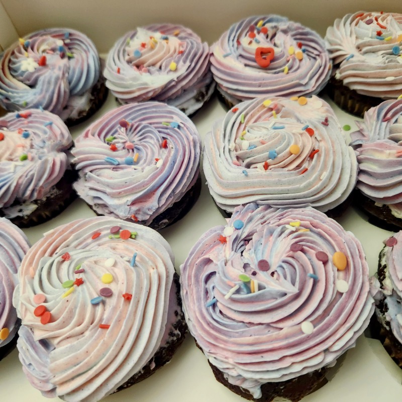 Photo of Chocolate Cupcakes with Marbled Purple Buttercream and Rainbow Sprinkles