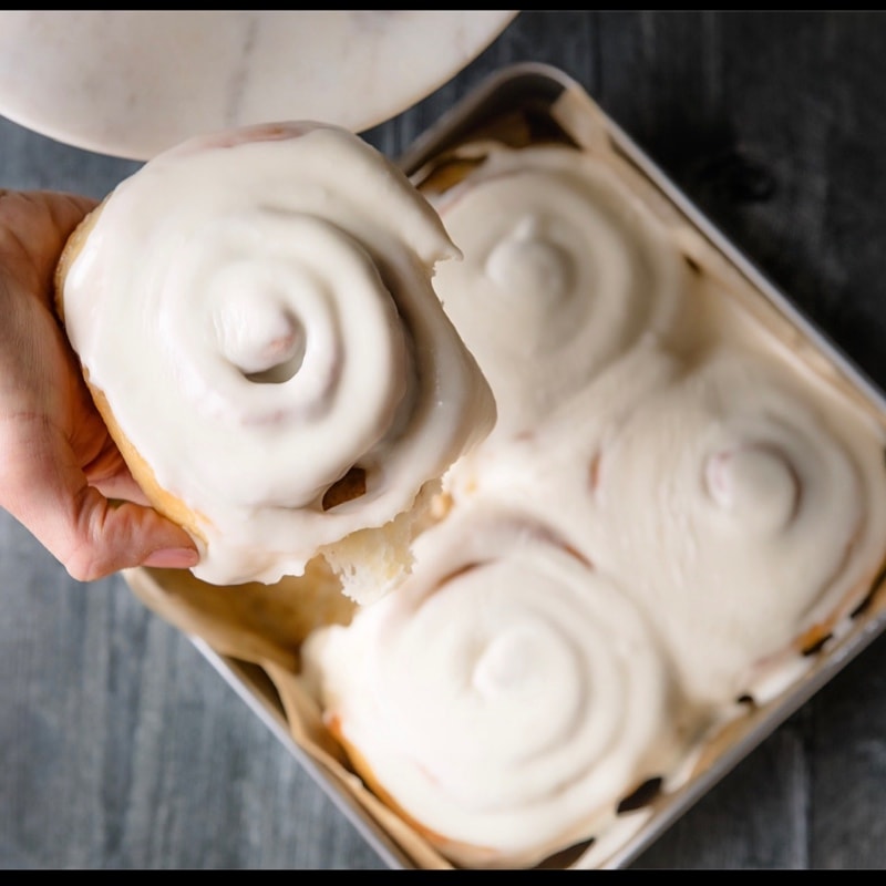 8x8 tray of four frosted cinnamon rolls