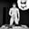 Black-and-white drawing of muscular, erect, uncircumcised man masturbating and thinking of woman in lacy bra and panties.