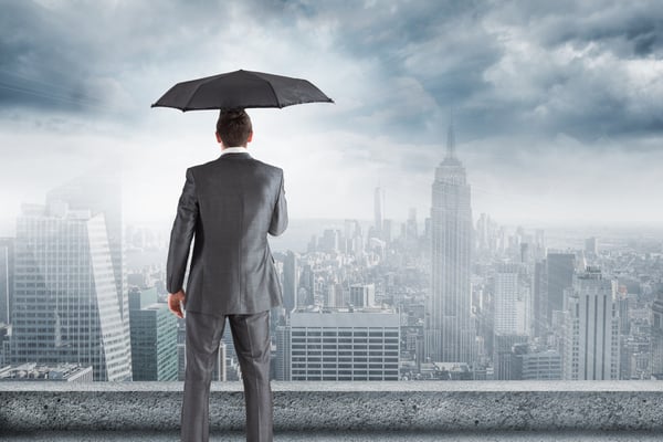 man-suit-umbrella-looking-city_1134-502