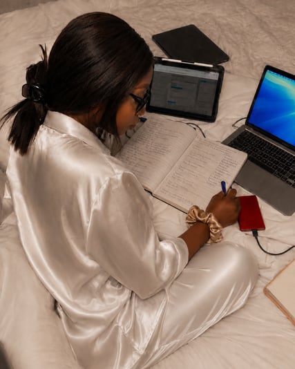Cozy study session on the bed