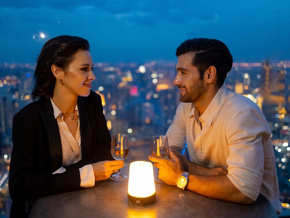 Couple enjoying drinks on a rooftop