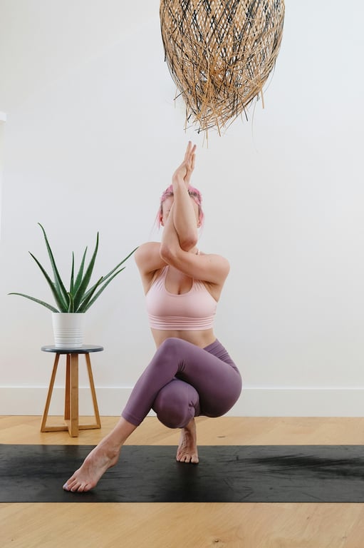 Woman in twisted yoga pose on mat