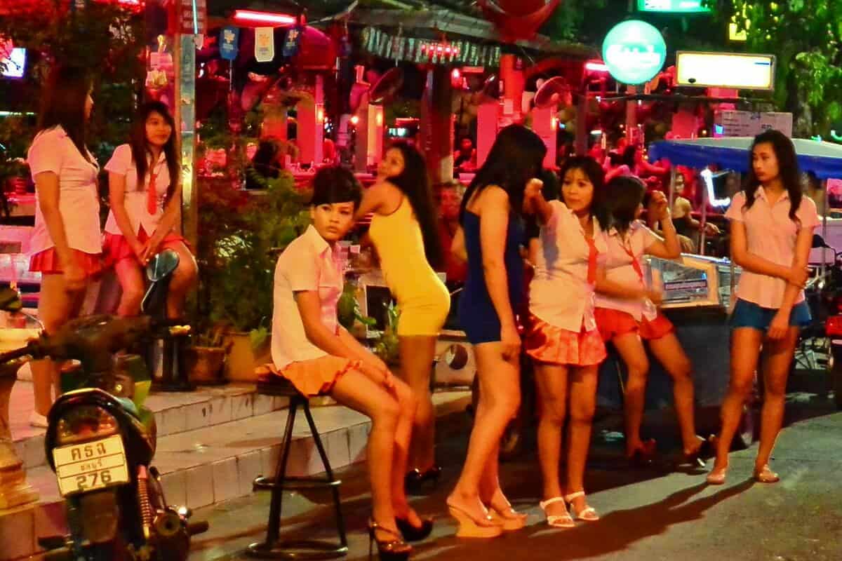 Thai women wearing skimpy outfits at a bar in Pattaya.