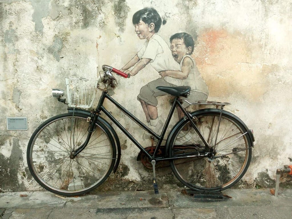 Children on a bicycle street art in Penang, Malaysia // travelmermaid.com