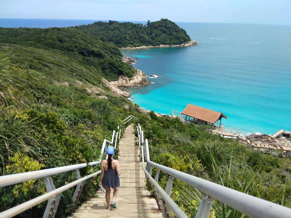 Walking down a boardwalk overlooking a beautiful bay on Perhentian Kecil, Malaysia
