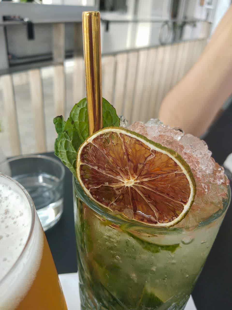 A mojito cocktail with a reusable metal straw // travelmermaid.com 