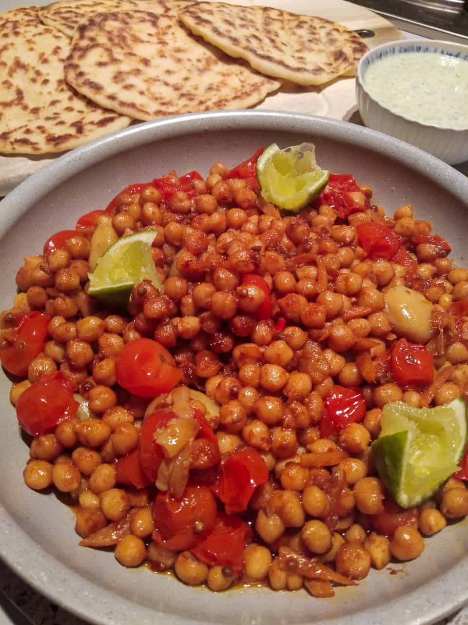 Confit tandoori chickpeas with homemade flatbreads and a coriander mint yoghurt // Travel Mermaid