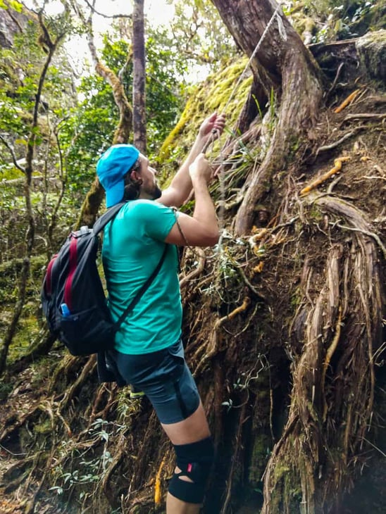 Climbing up a rock to reach The Devil's Thumb Viewpoint- Queensland, Australia // Travel Mermaid
