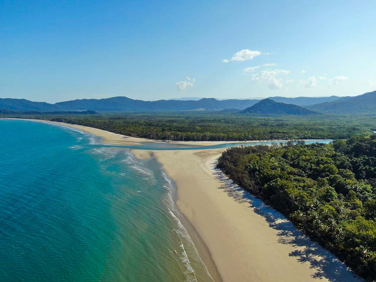 An aerial shot of Thornton Beach and the Daintree Rainforest in Cape Tribulation, Australia // Travel Mermaid