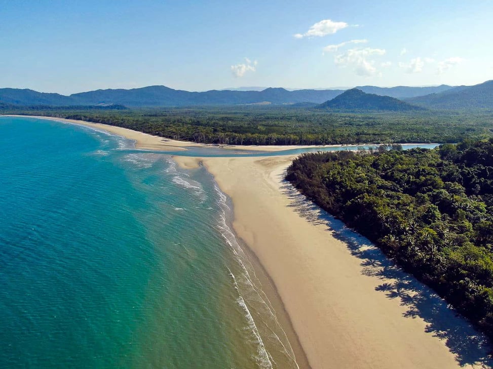 An aerial shot of Thornton Beach and the Daintree Rainforest in Cape Tribulation, Australia // Travel Mermaid