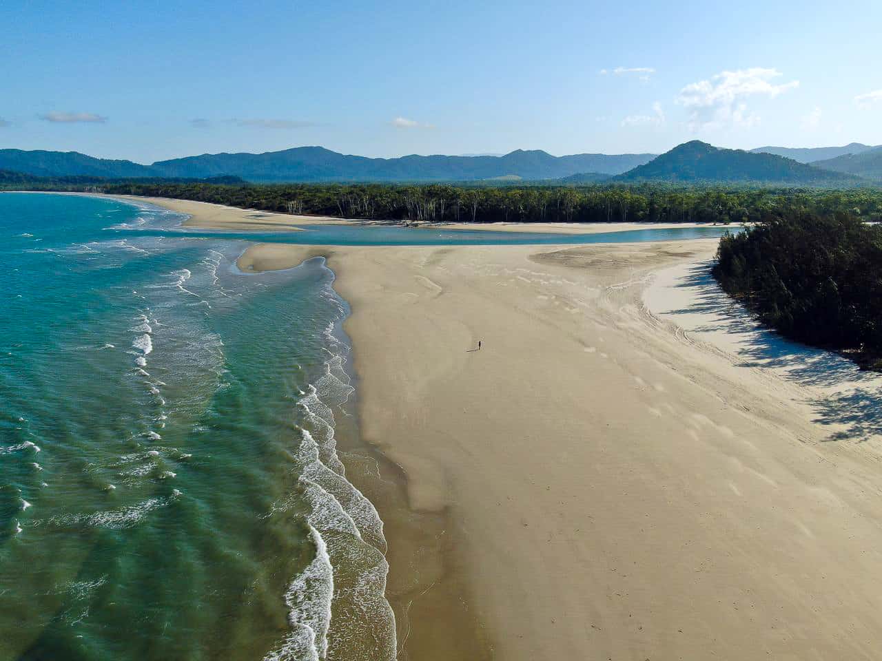 An aerial shot of Thornton Beach and the Daintree Rainforest in Cape Tribulation, Australia // Travel Mermaid