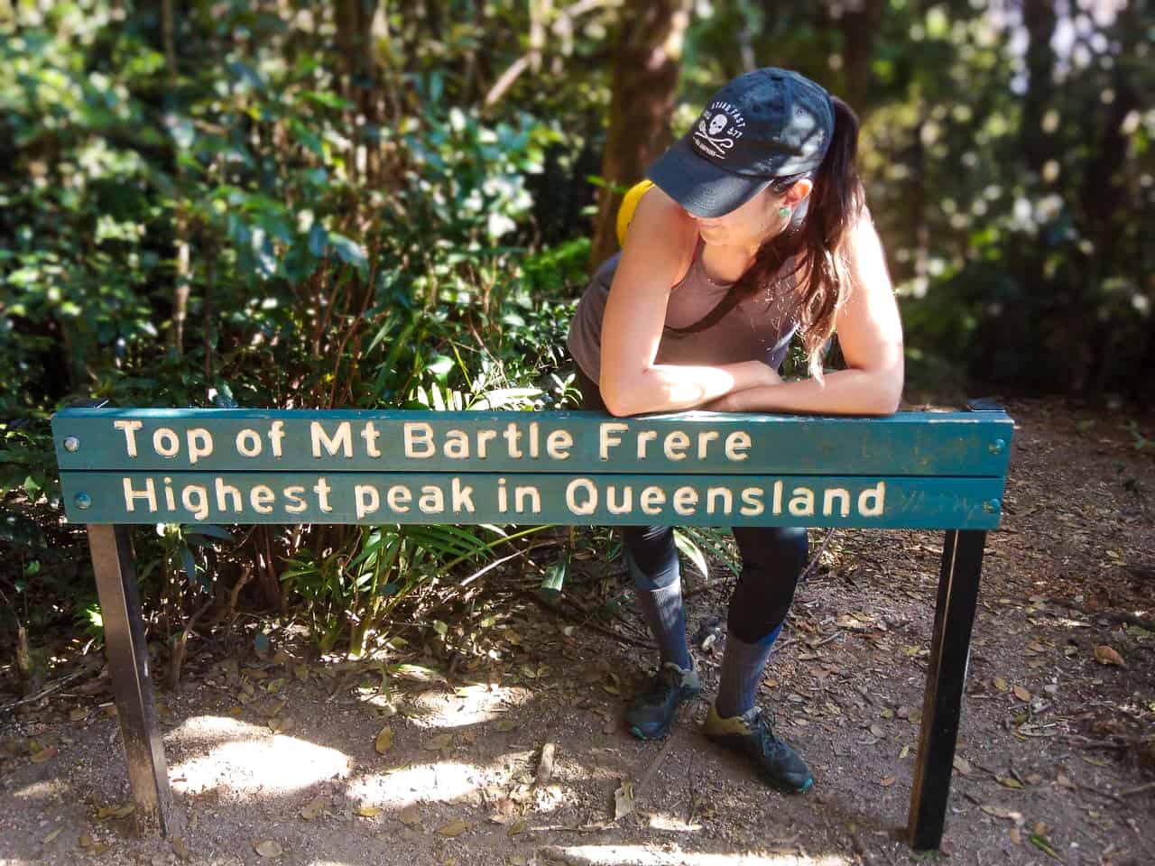 Standing at the Mount Bartle Frere summit sign, Australia // Travel Mermaid