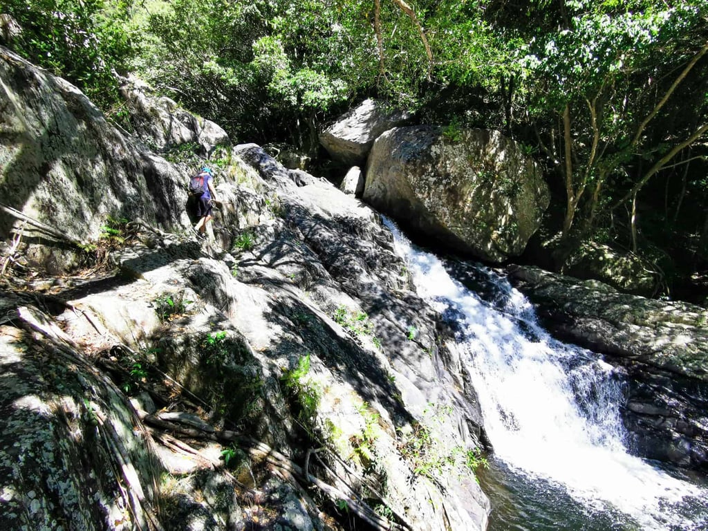Climbing over the rocks on the Spring Creek hike in Mowbray // Travel Mermaid