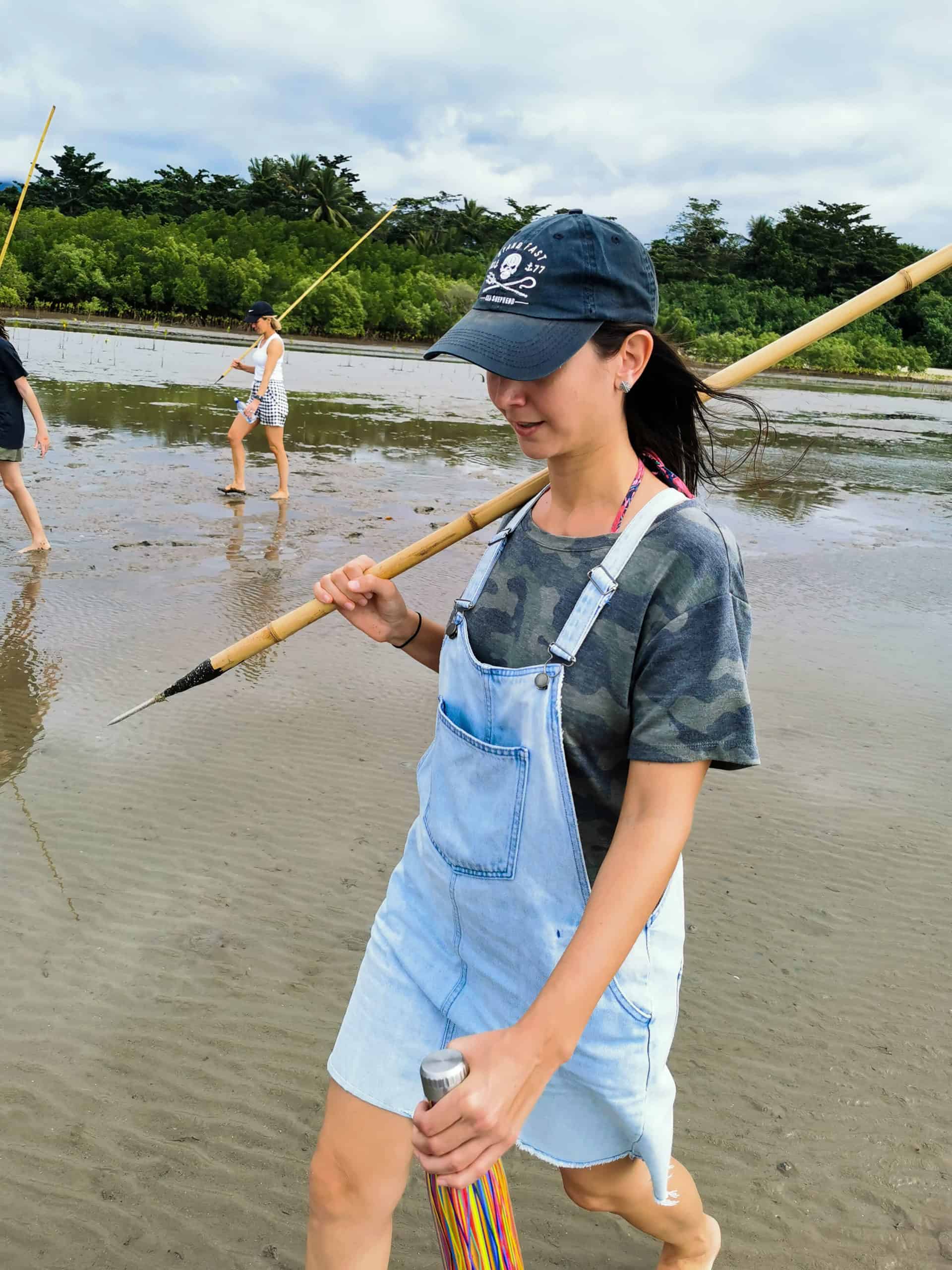 Spearfishing for mud crabs at Cooya Beach with Walkabout Cultural Adventures // Travel Mermaid