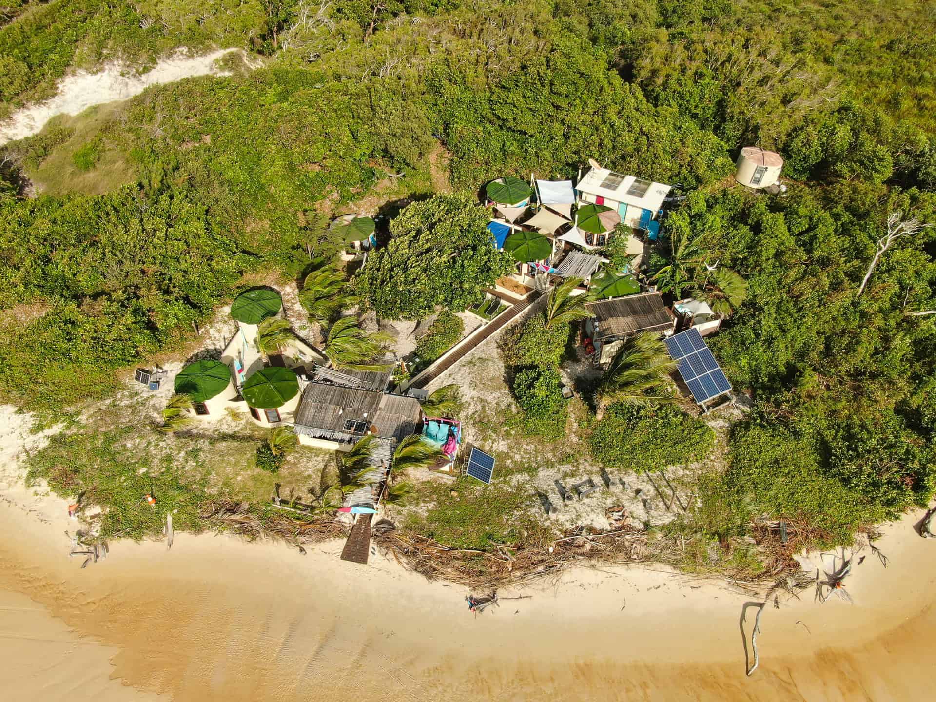 A drone shot of 'Tank Town' kitestay at Australian Kite Surfari on Elim Beach, Far North Queensland // Travel Mermaid