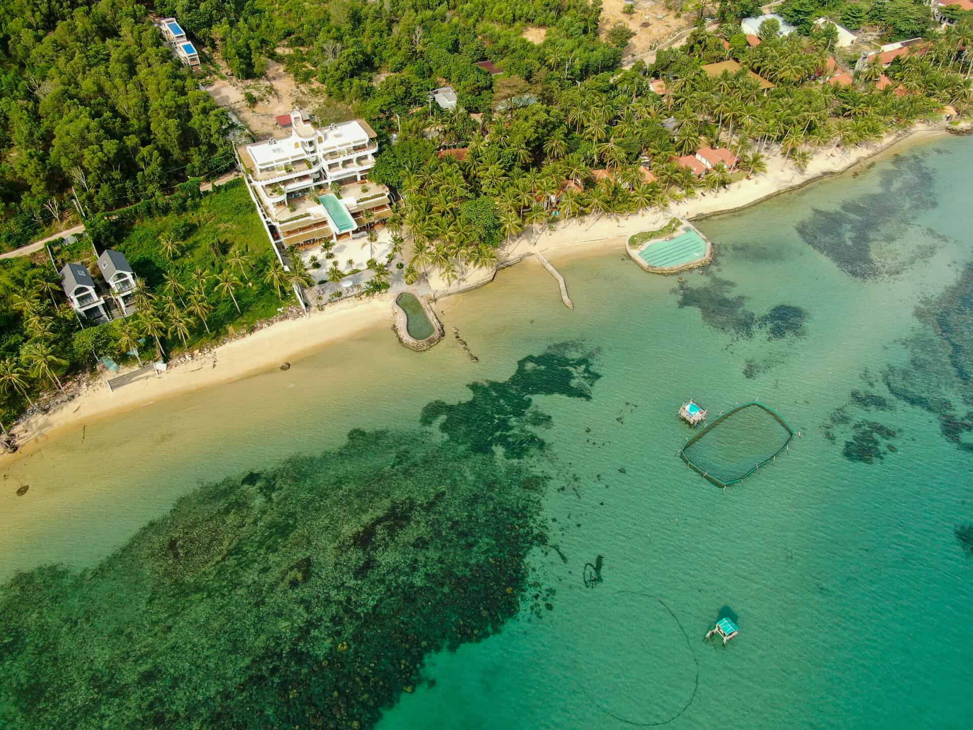 A drone shot of idyllic Casa D'Elysea beach villa in Phu Quoc, Vietnam