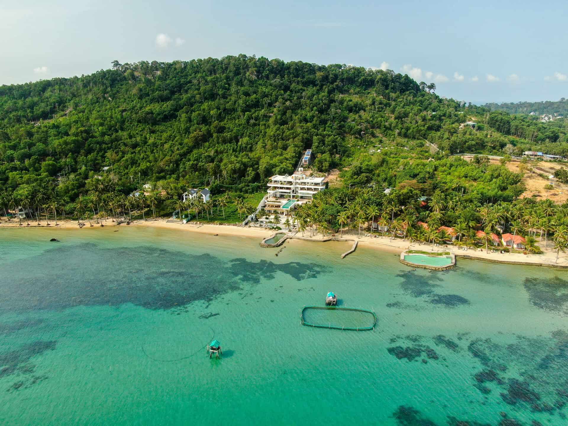 A drone shot of idyllic Casa D'Elysea beach villa in Phu Quoc, Vietnam