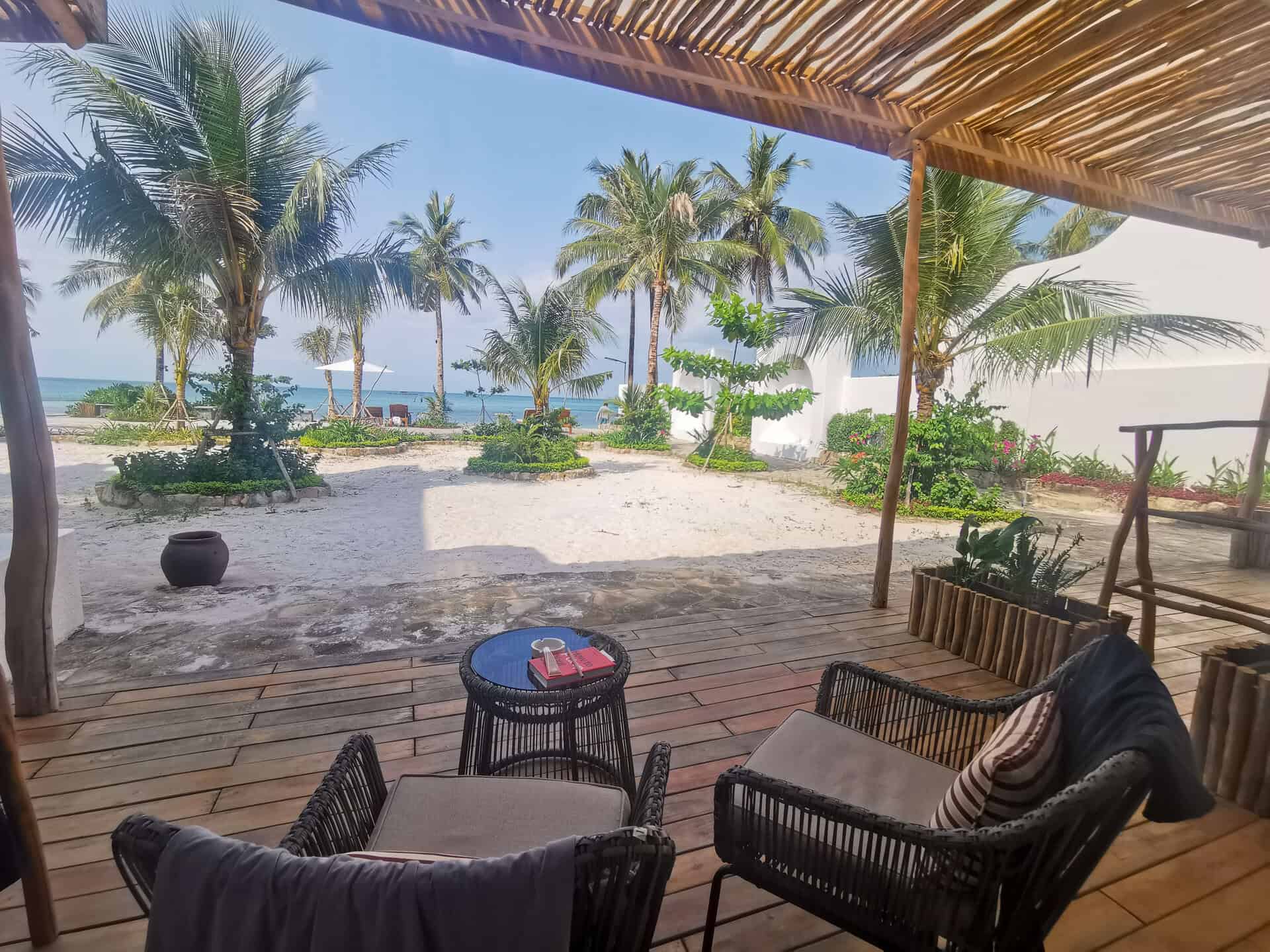 View of the beach from the patio at Casa D'Elysea Resort in Phu Quoc, Vietnam