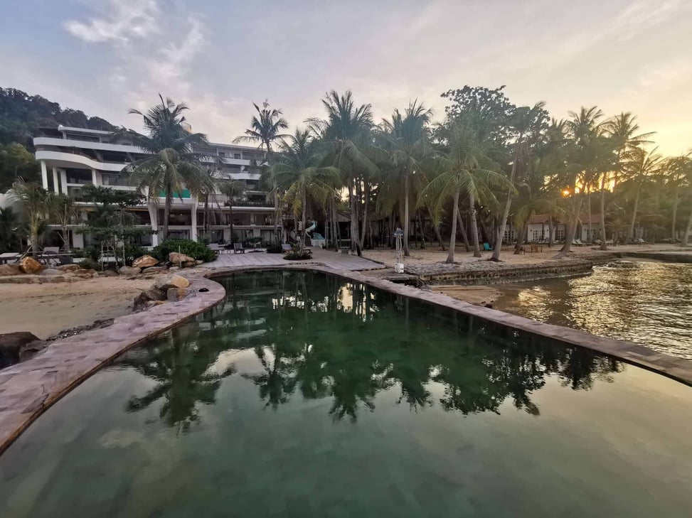 The pool and Casa D'Elysea Resort at dusk, in Phu Quoc, Vietnam
