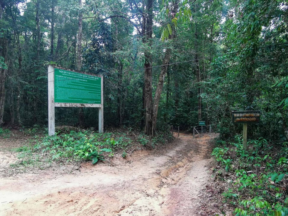 Signs opposite the Into The Wild hiking trail in Phu Quoc, Vietnam