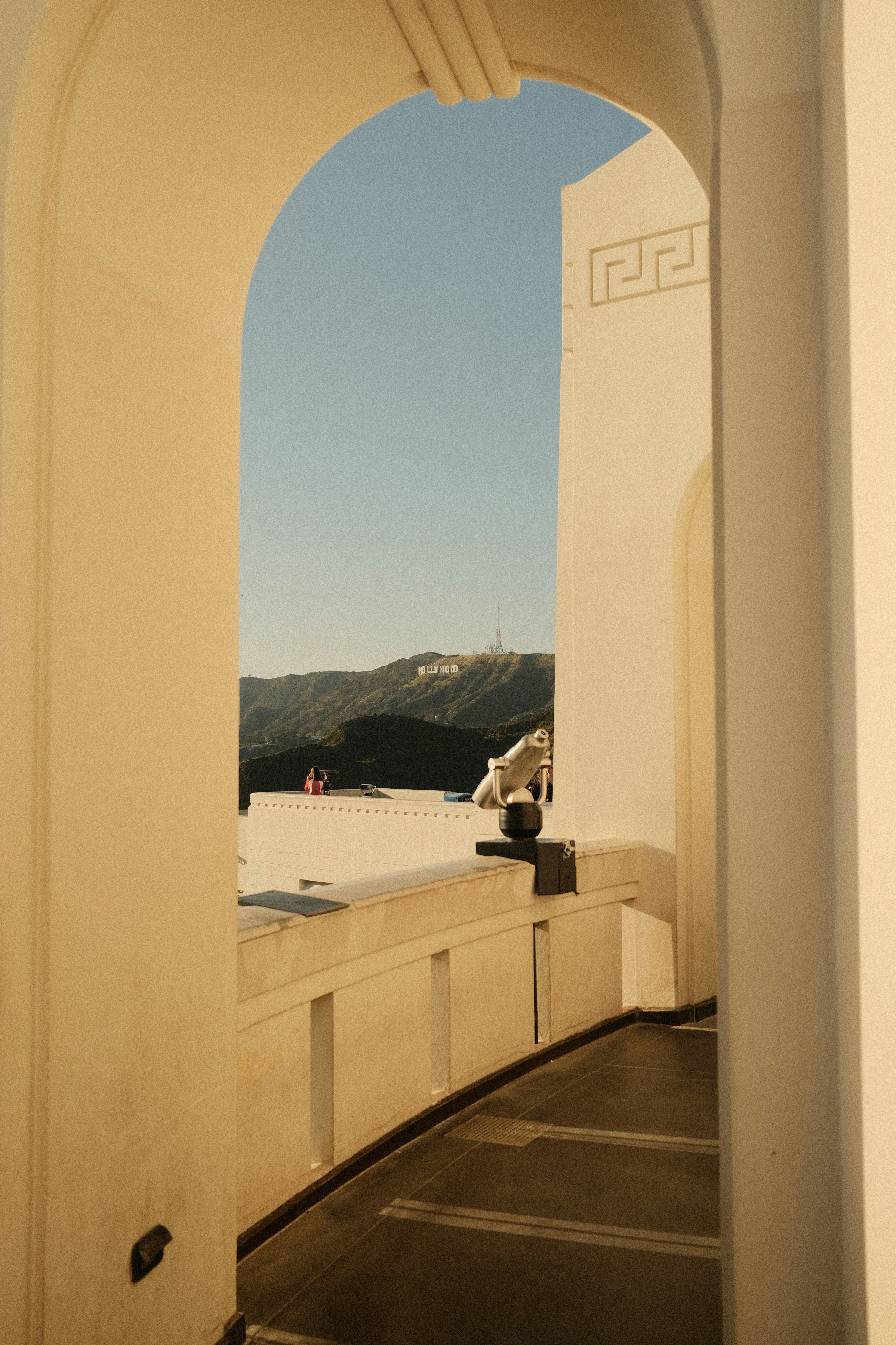 Griffith Observatory with the Hollywood Sign and Los Angeles skyline in the background