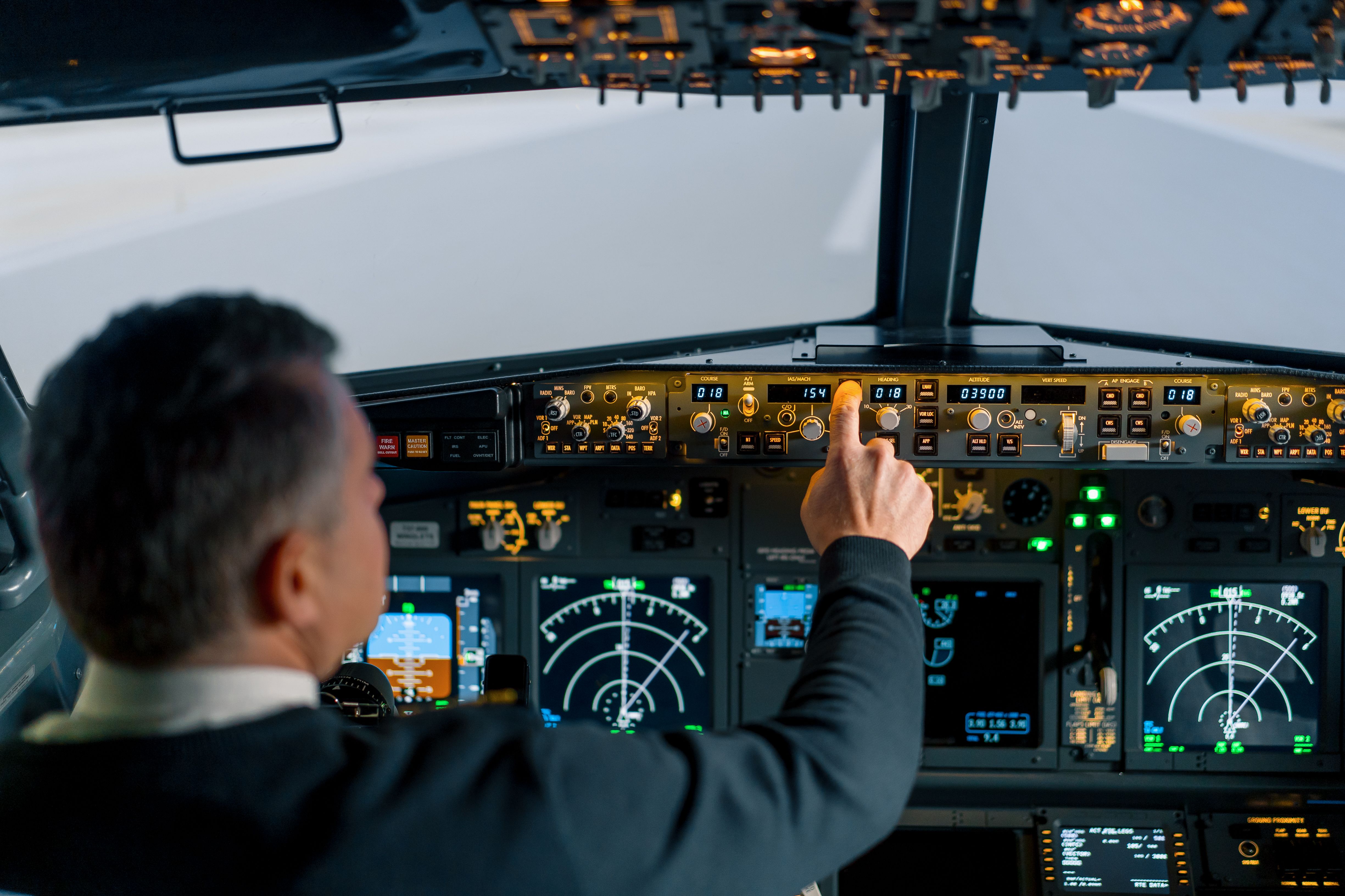 Pilot operating flight controls in Boeing 737 simulator