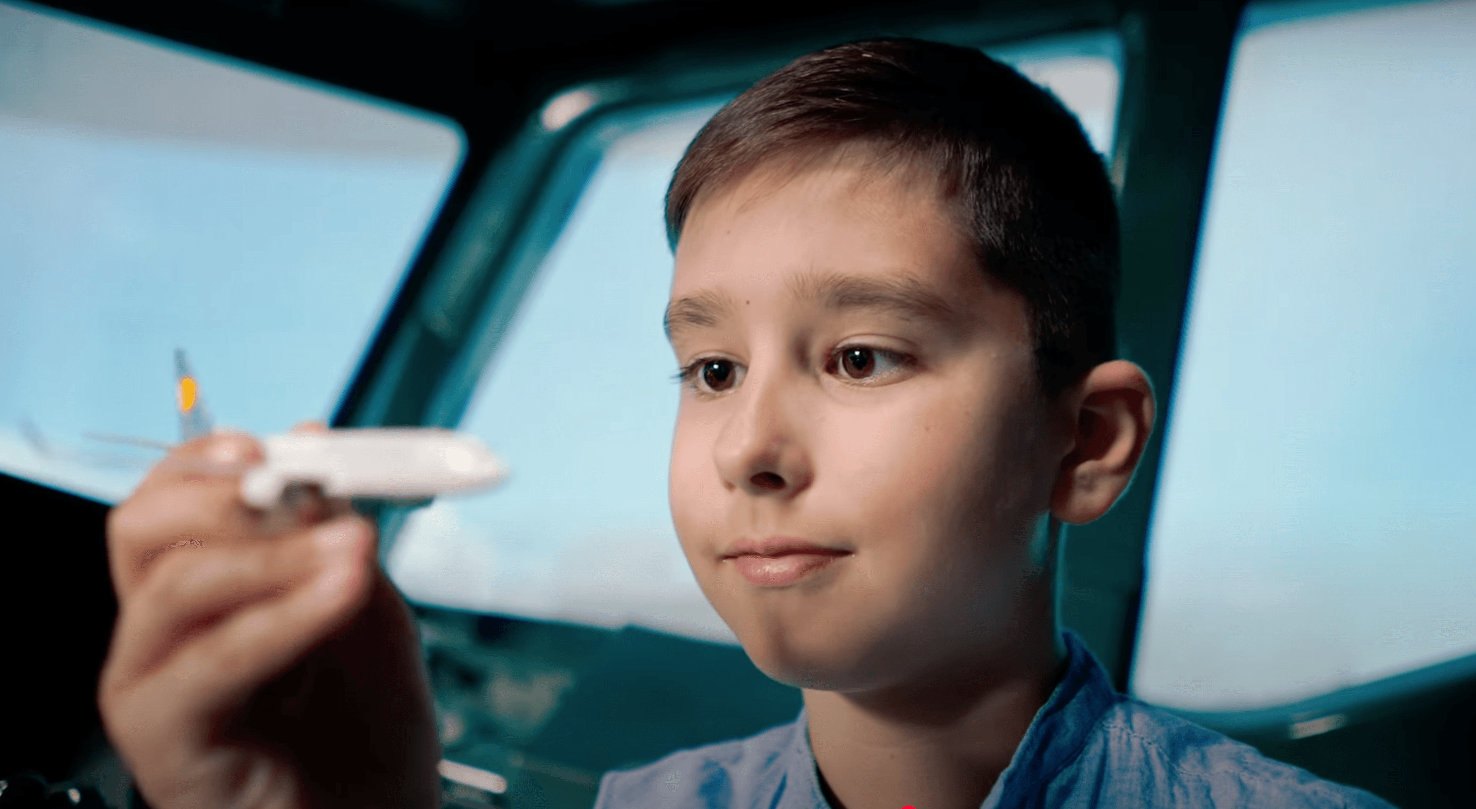 Young aviation fan flying the Boeing 737 simulator at WeFly — simulated flight experience for kids in the Los Angeles area