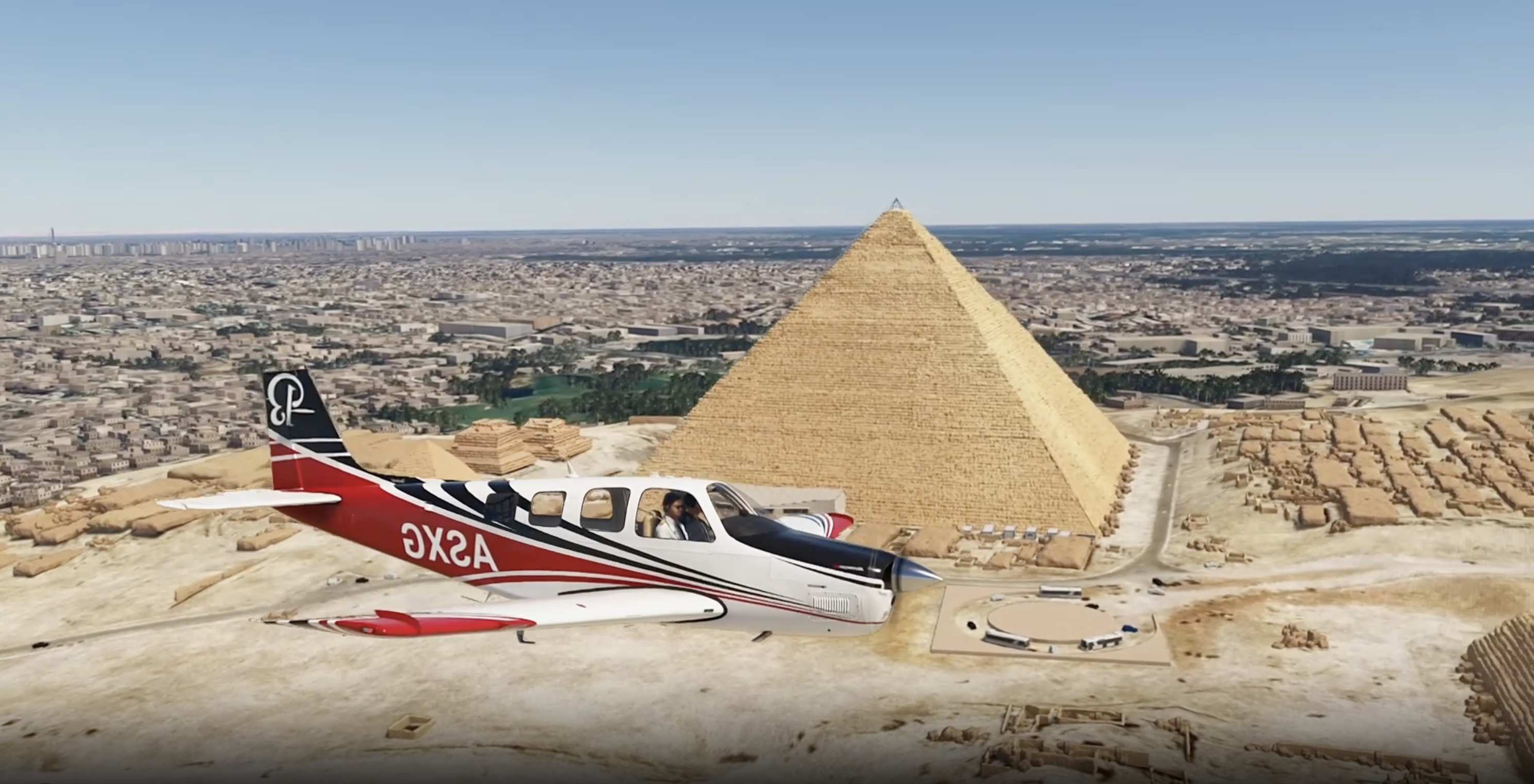 Cessna aircraft flying over pyramids in flight simulator