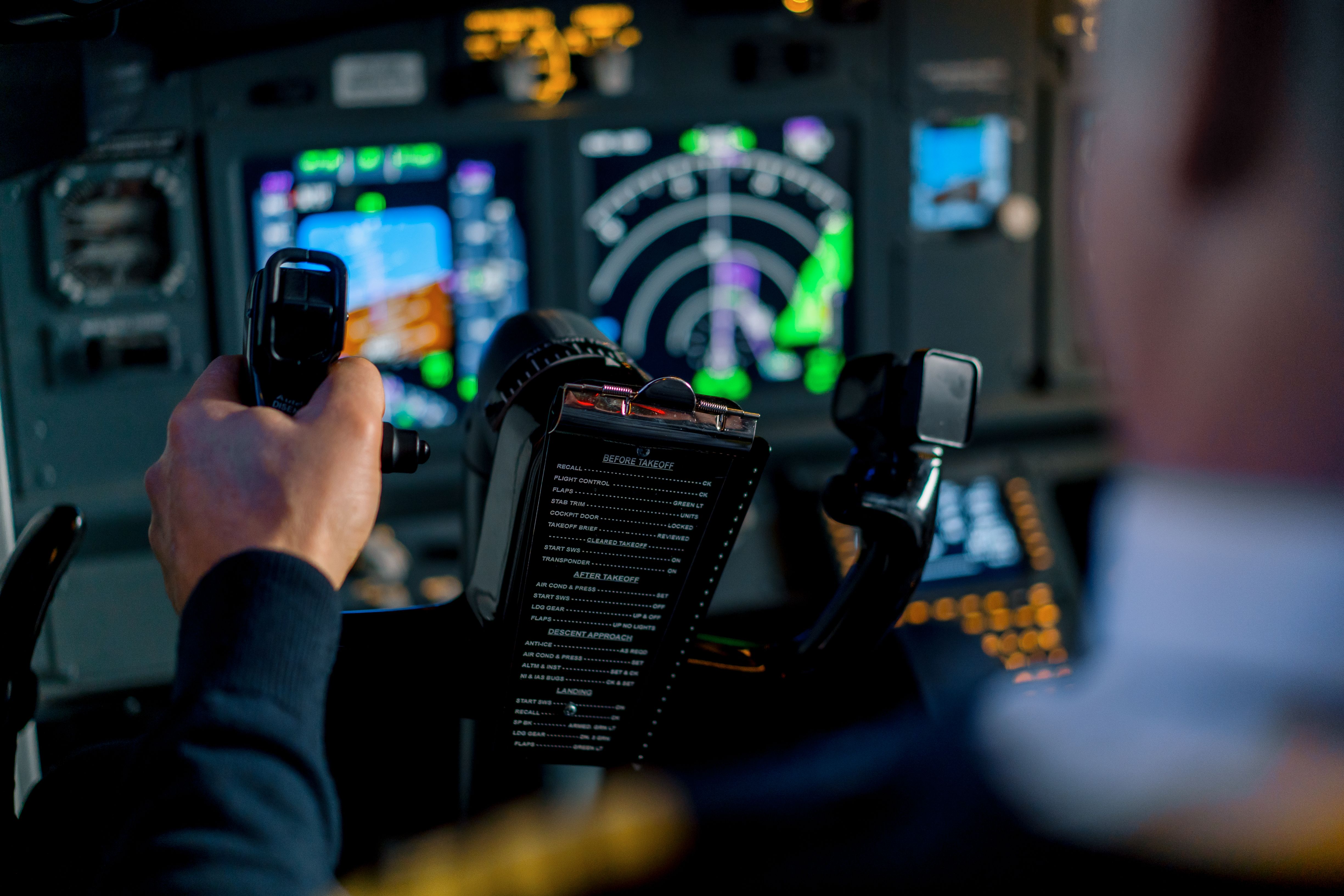 Pilot using navigation system in Boeing 737 simulator