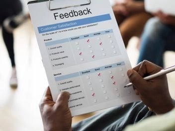 Hand ticking off facebook checklist