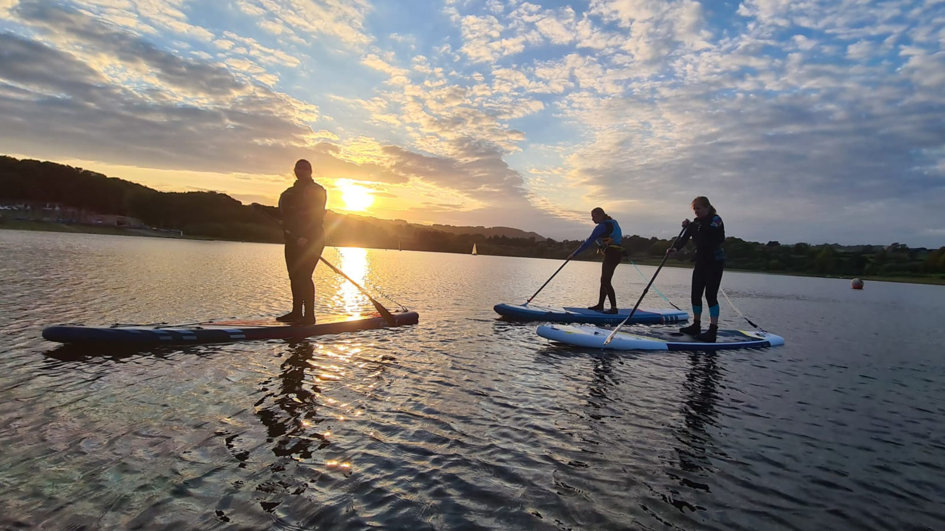 Kate Allatt paddleboarding with friends at Ogston Sailing Club