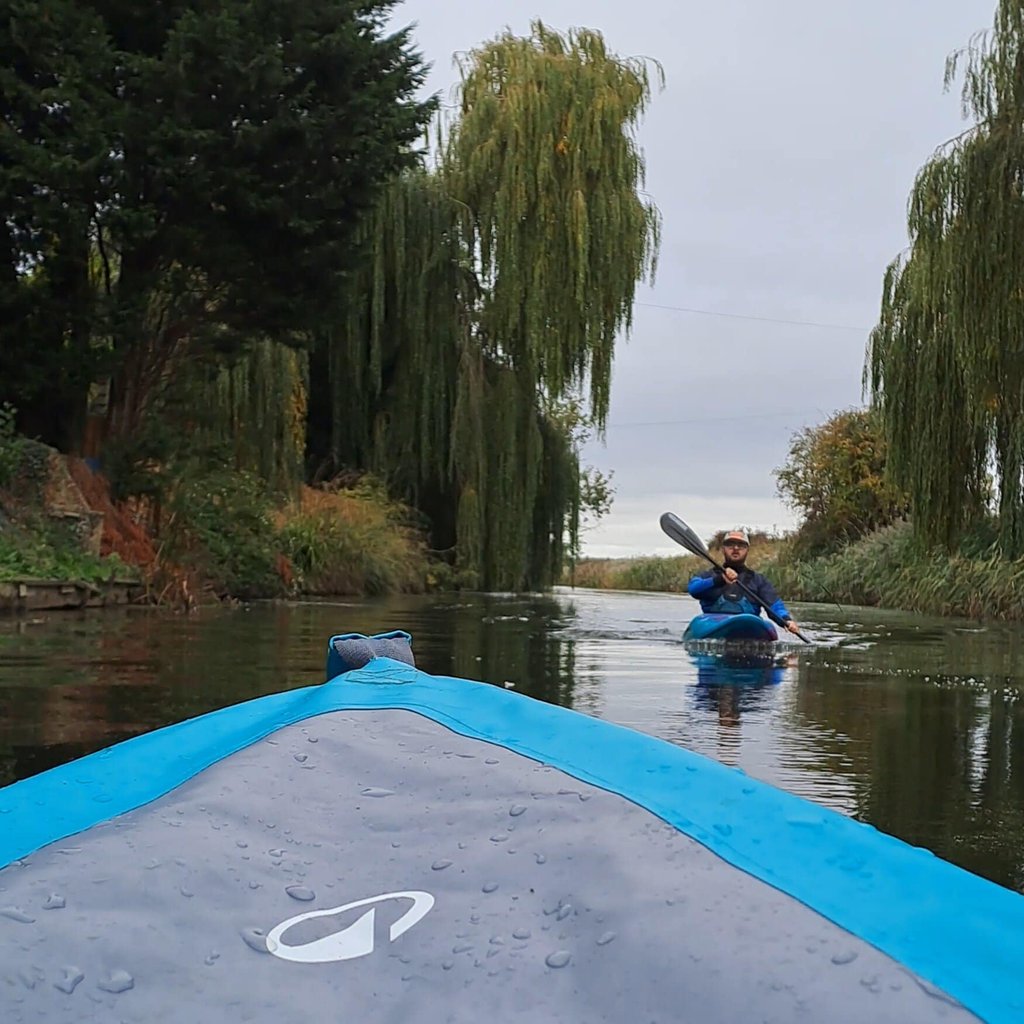 Paddling past houses along the Ramsey Drain