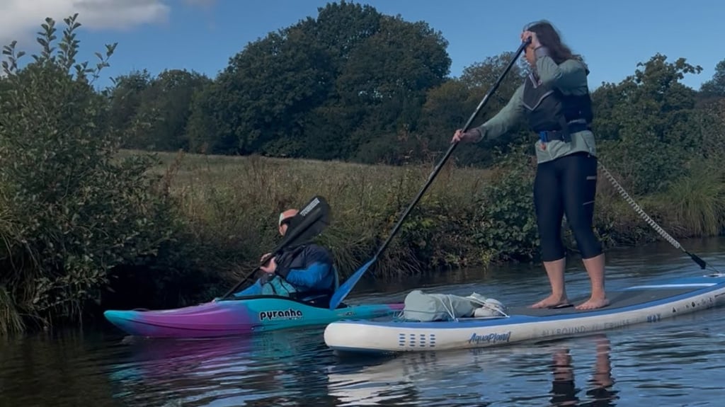 Kayaker and paddleboarder
