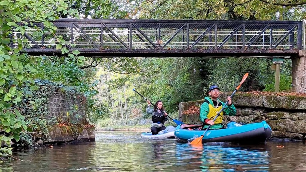 Peak Forest paddlers going under a bridge