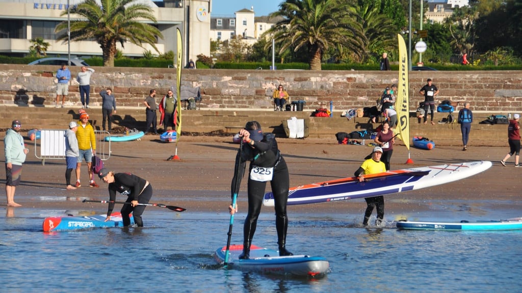 SUP athletes leaving the beach in Torquay