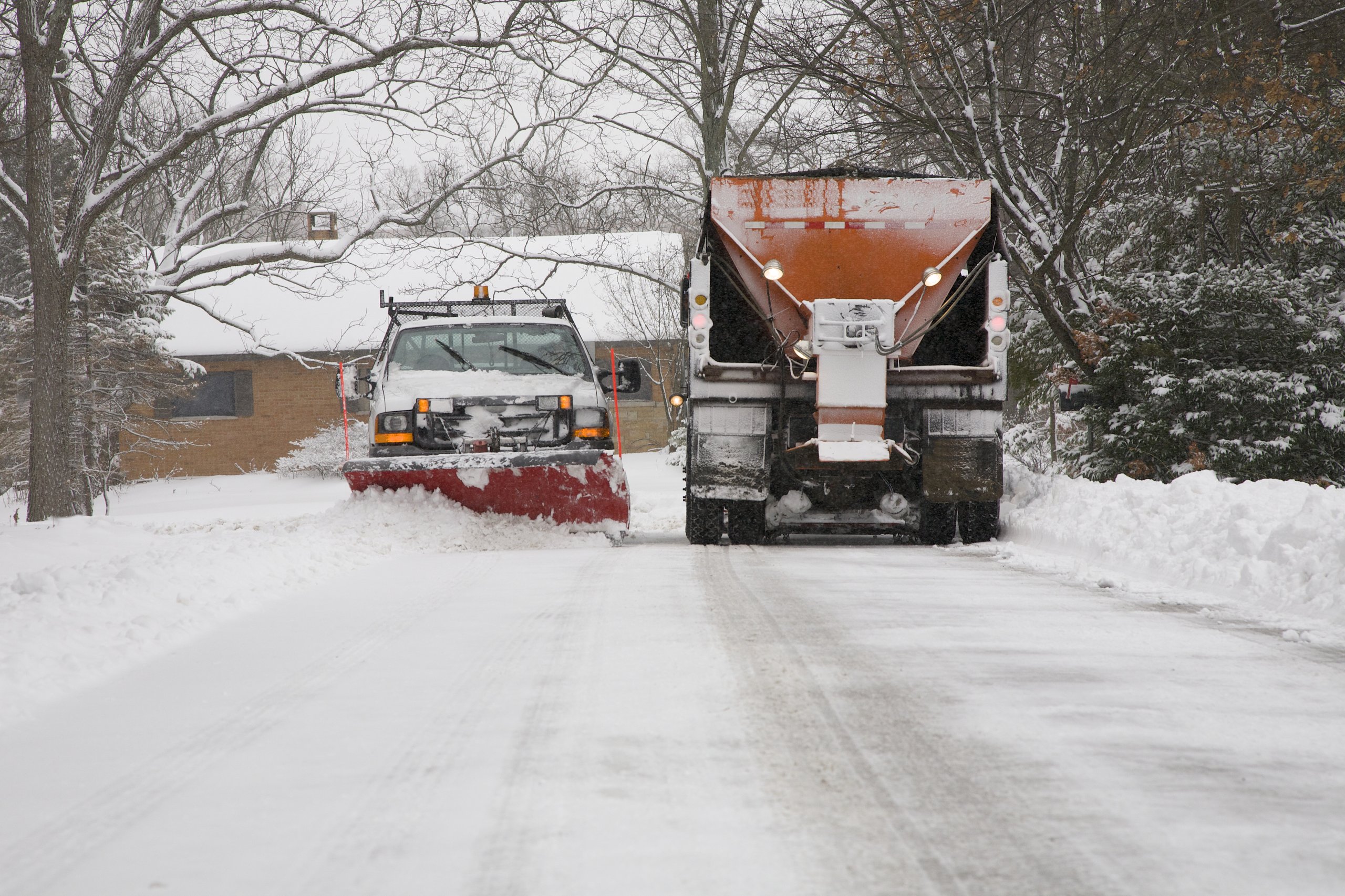 Snow plow truck clearing the road