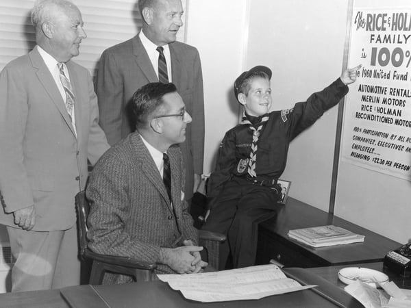 Black and white picture of men with and child