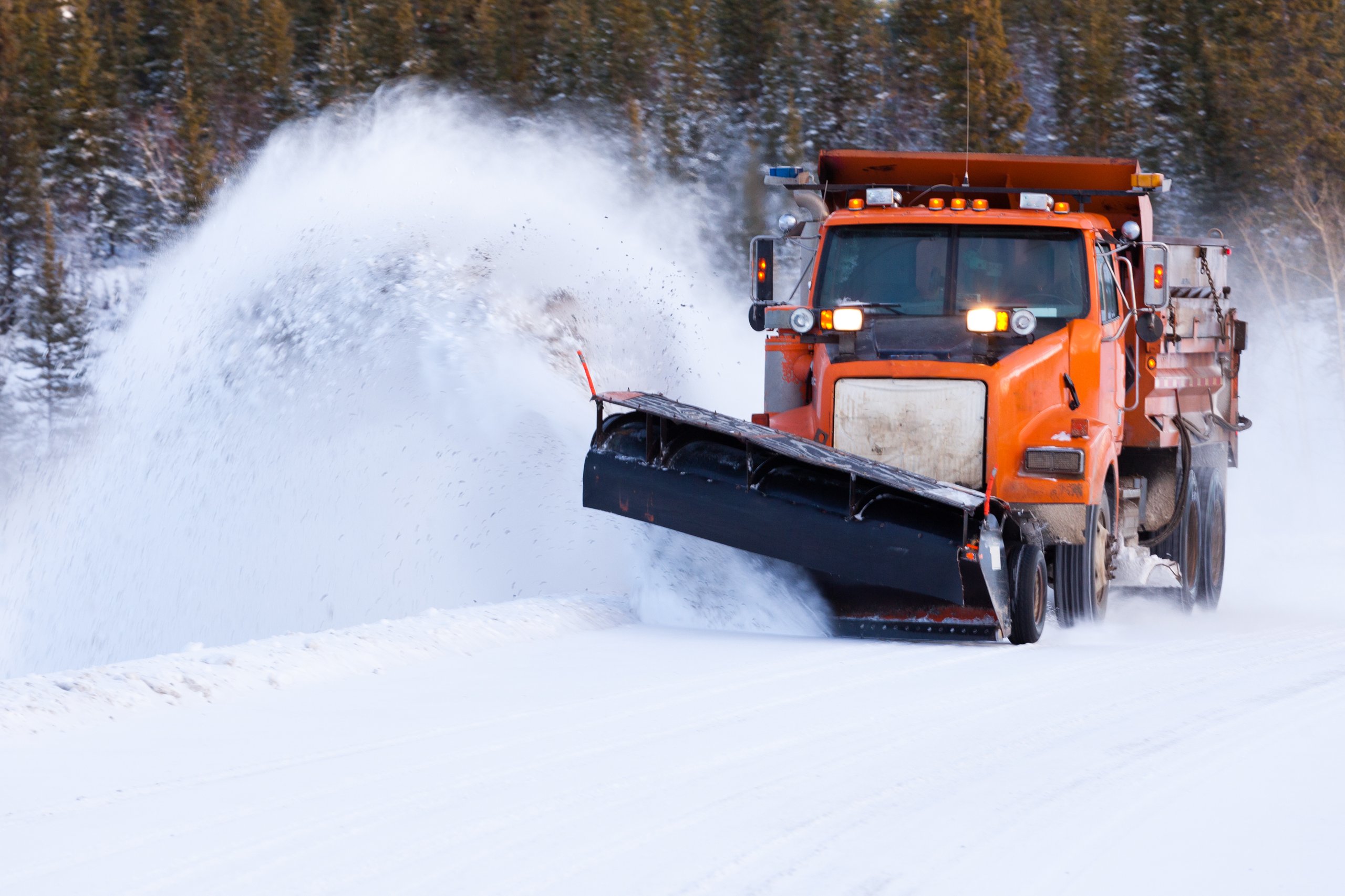 Heavy truck plowing snow