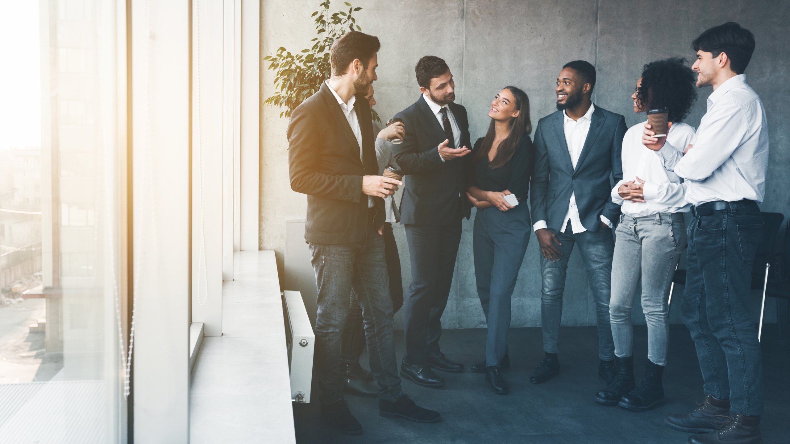 People discussing while drinking coffee