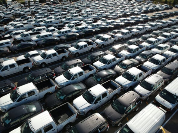 a large group of cars in a parking lot