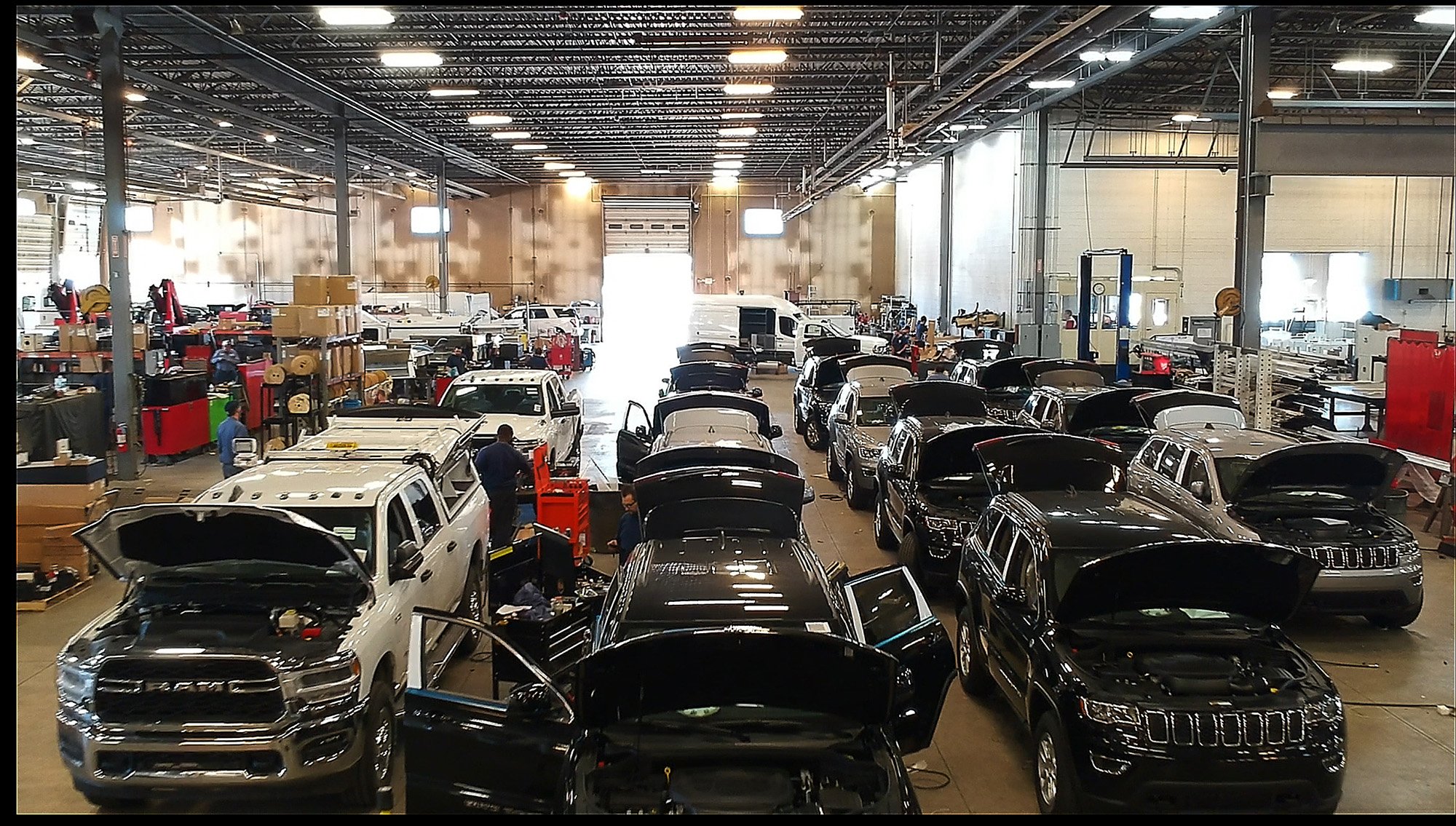 a group of cars in a warehouse