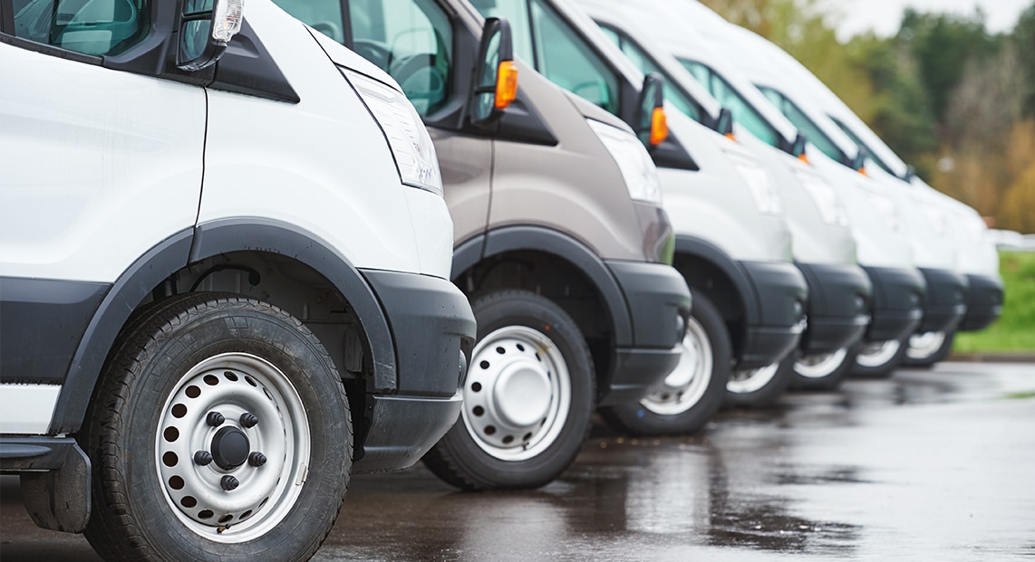a row of vans parked in a row