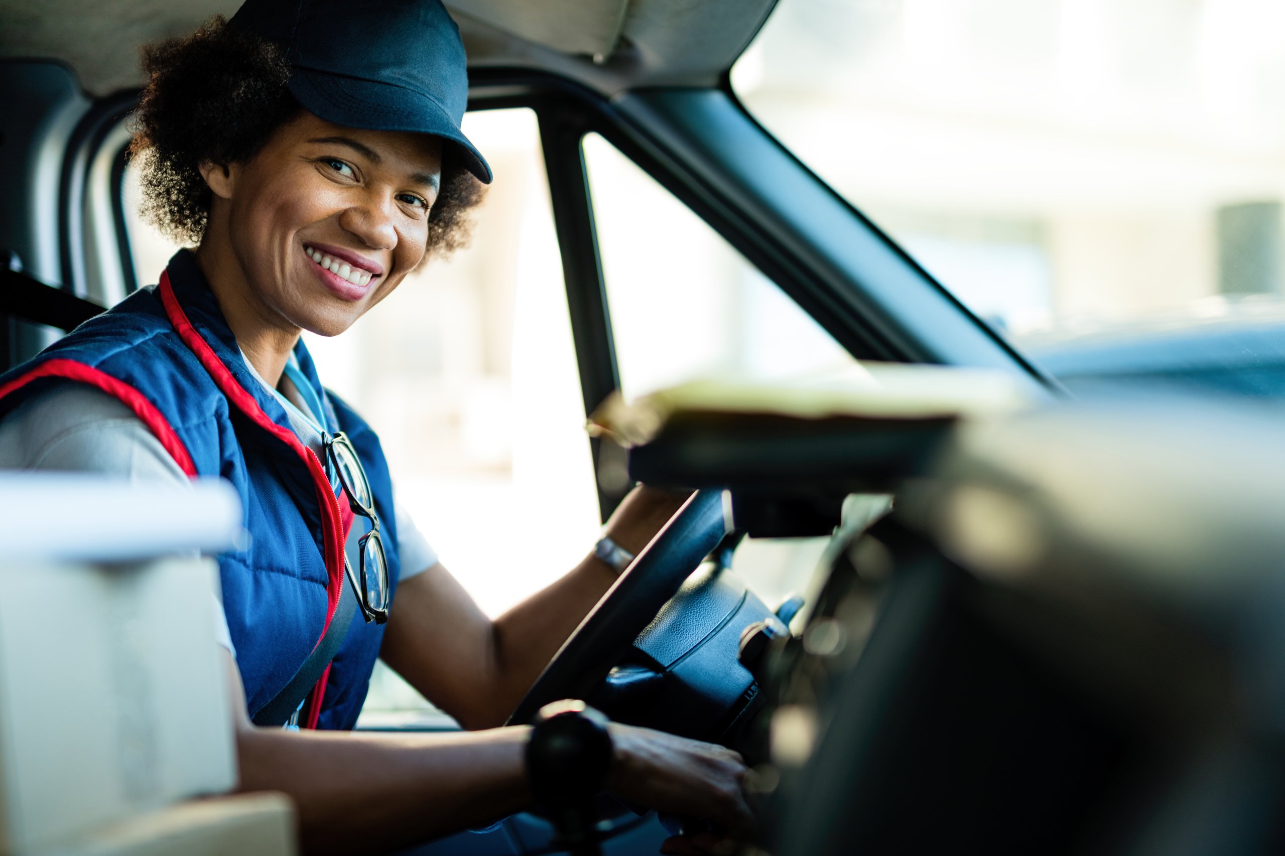 a woman in a car smiling