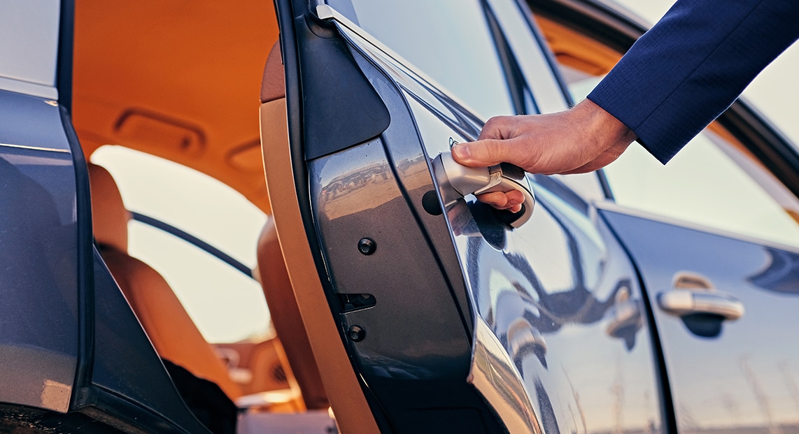 a person opening a car door