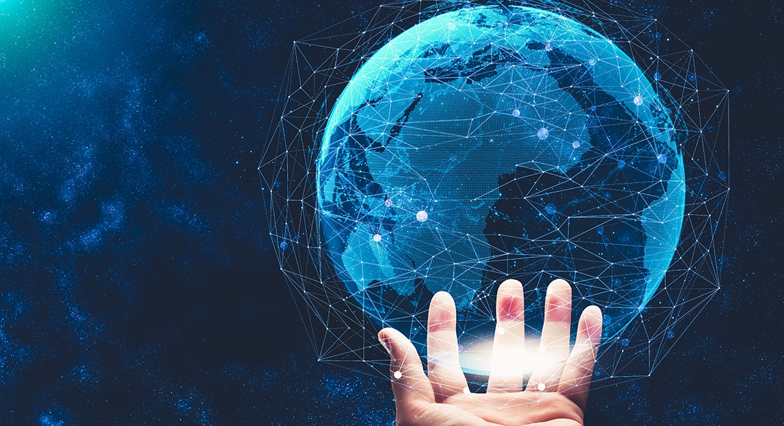 a hand touching a globe