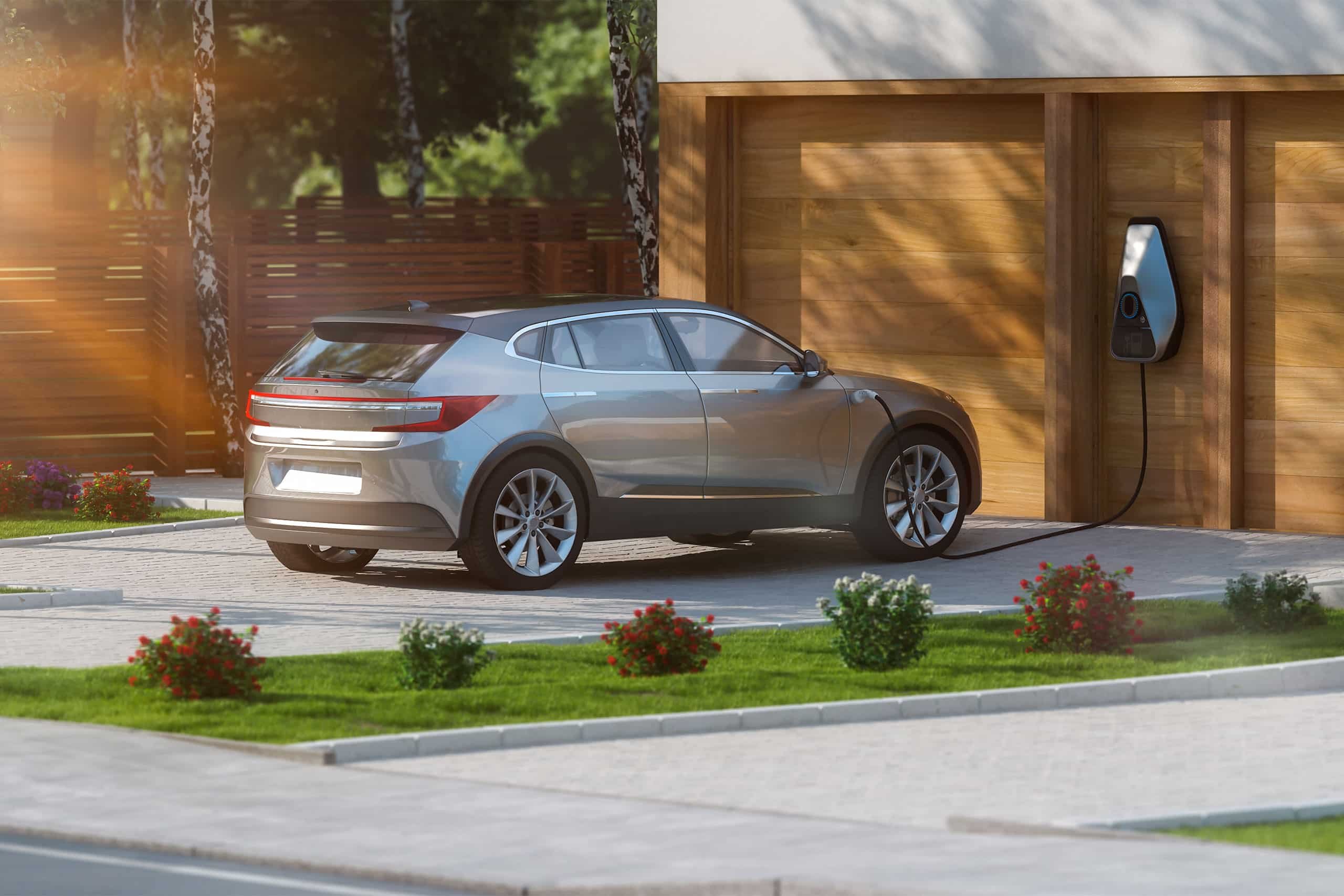 a silver car parked in front of a garage door
