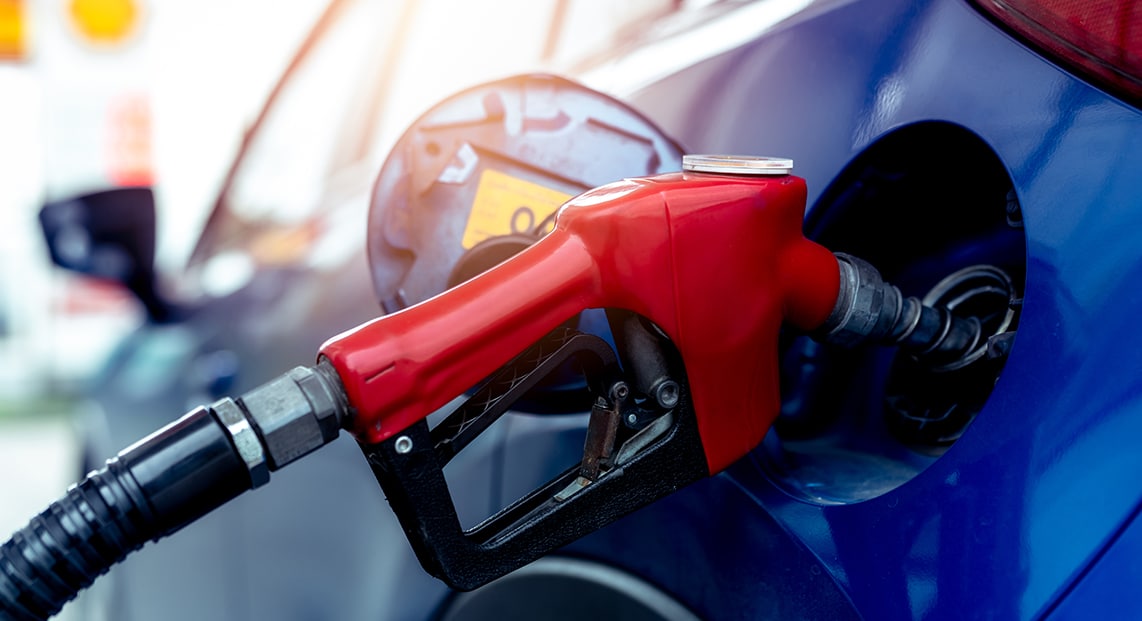 a red gas pump nozzle