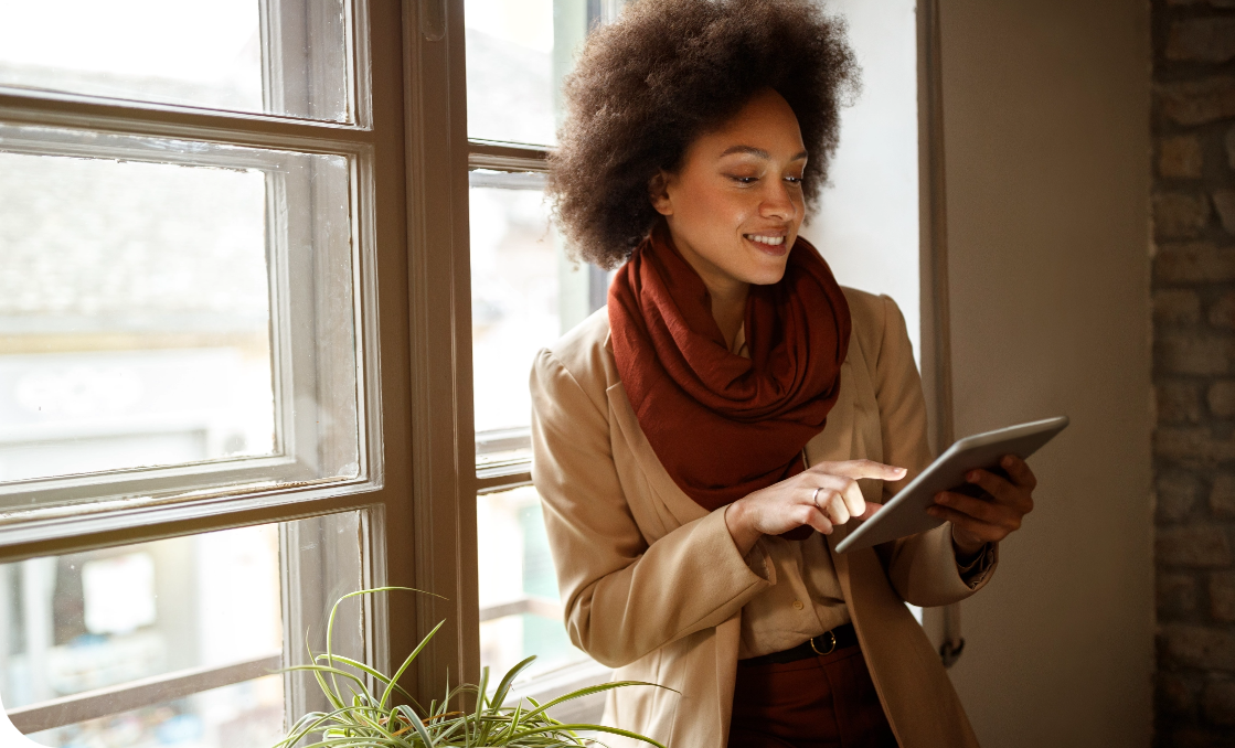 a woman looking at a tablet
