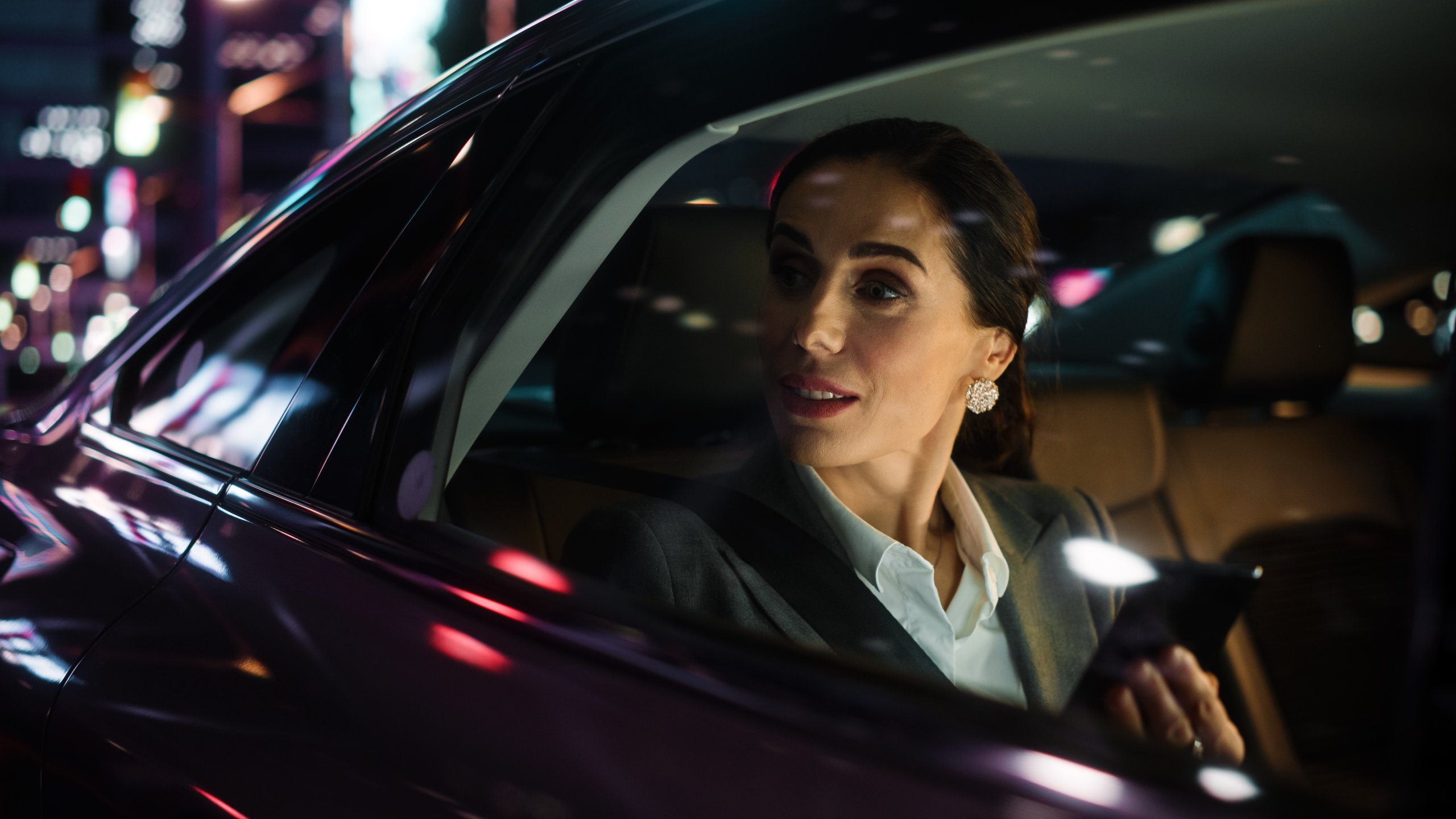 Woman looking through a car window